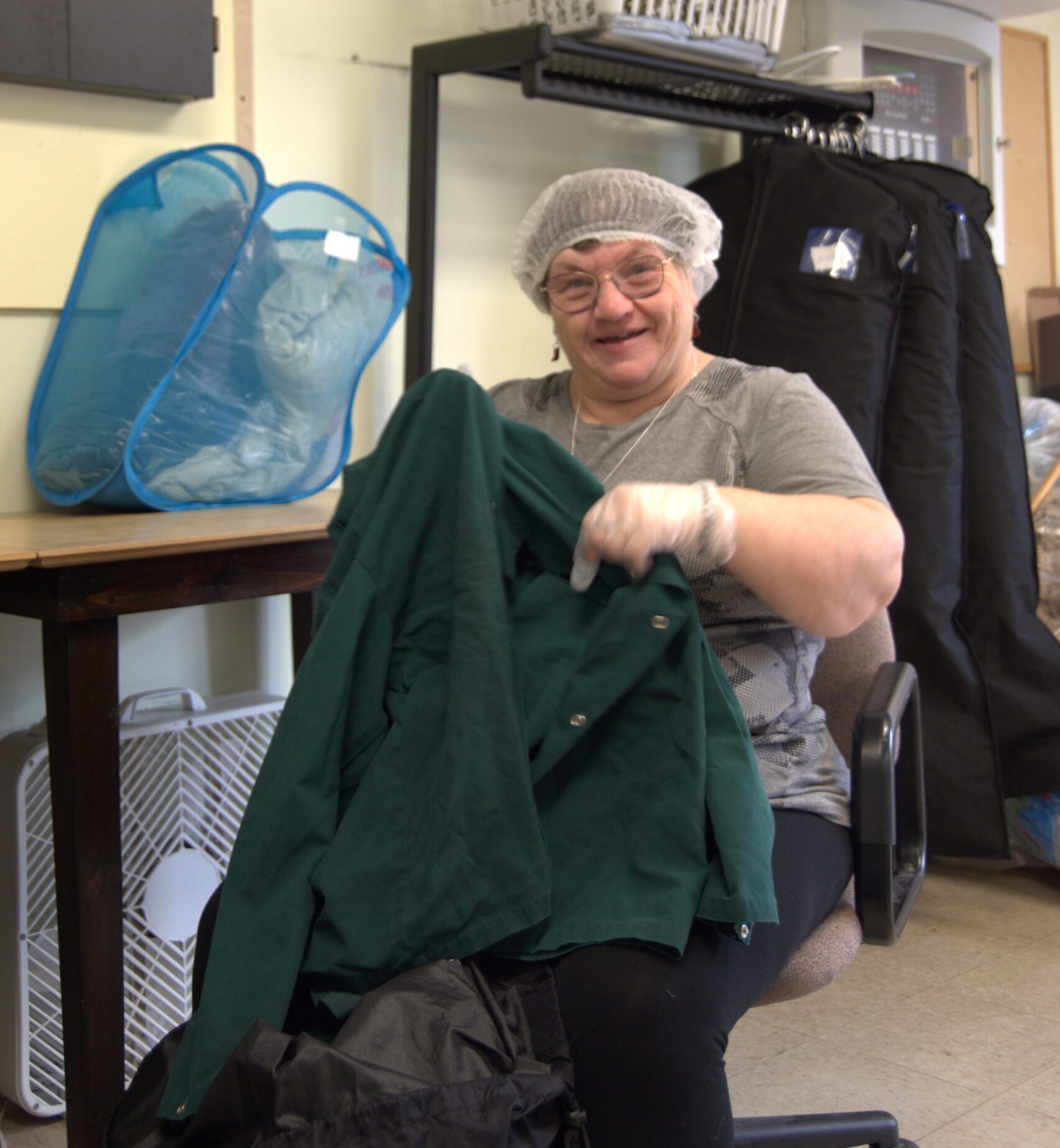 Employee sorting clothes