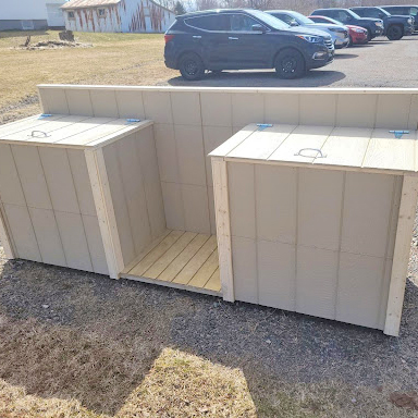 A two-bin garbage system with space for a green compost bin in the middle.