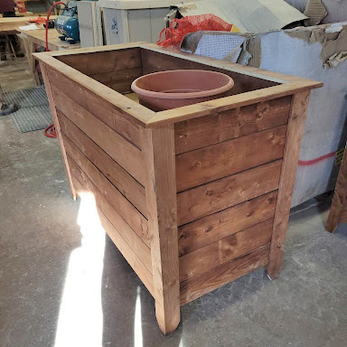 A patio planter stained brown